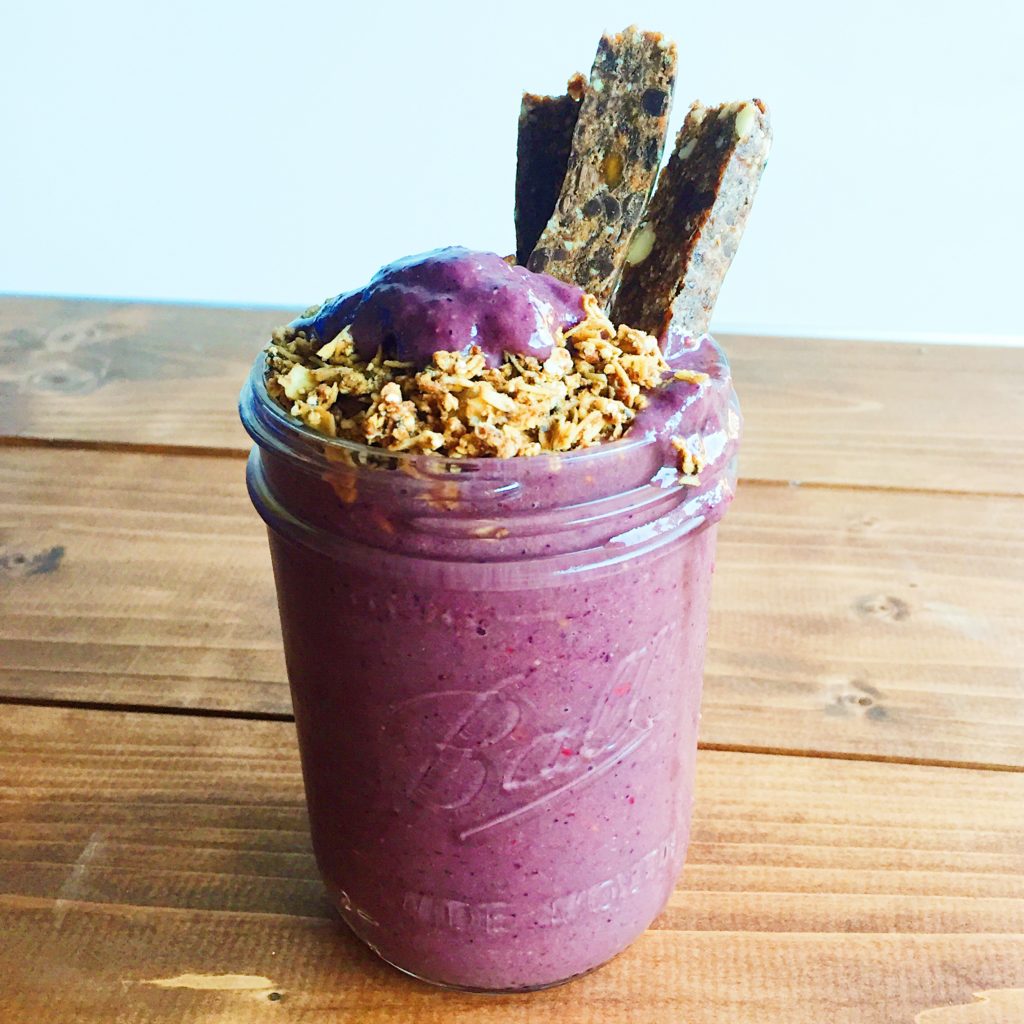 purple smoothie with granola and grain bar