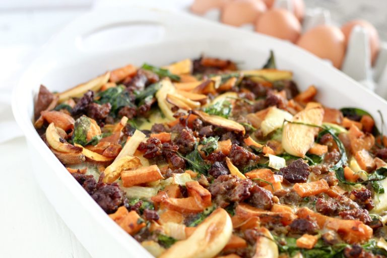 Caramelized Onion, Apple, and Sweet Potato Overnight Breakfast Bake in a white pan