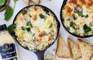 Creamy Dijon Spinach Artichoke Dip in cast iron skillets