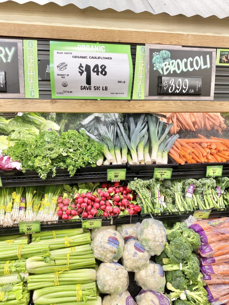 organic section sprouts with broccoli, cauliflower, carrots, and other produce