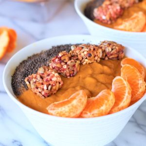 sweet potato sunrise smoothie topped with orange slices