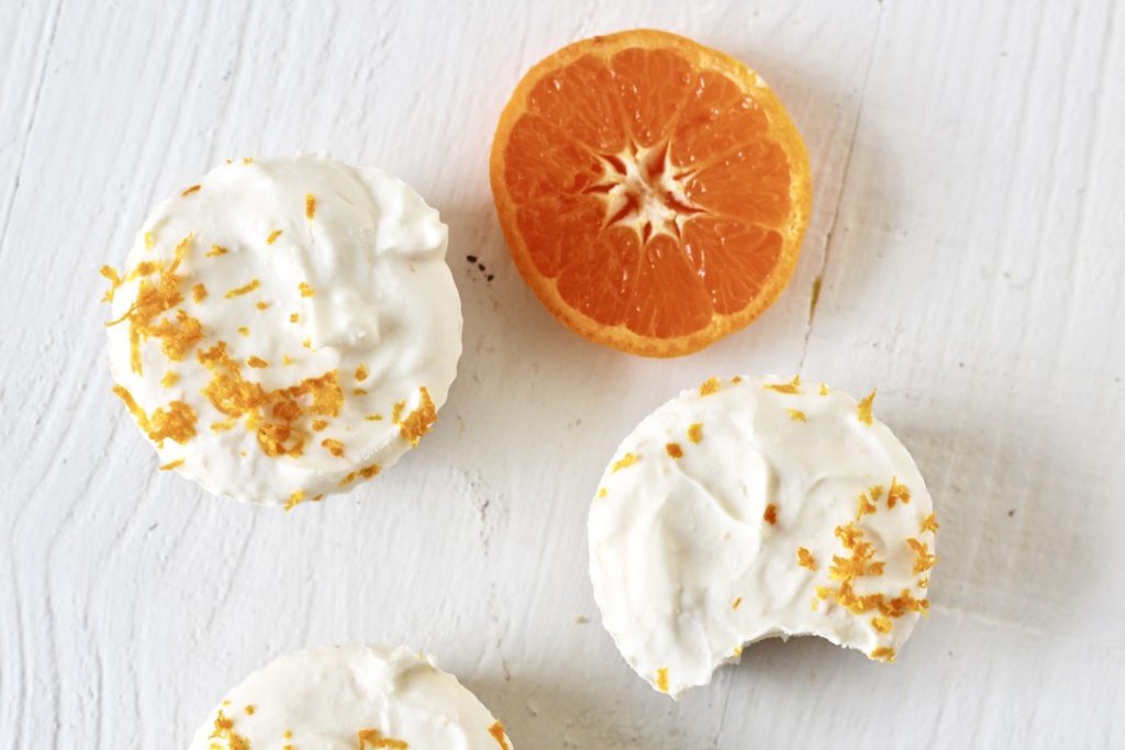 cheesecake cups with sliced orange