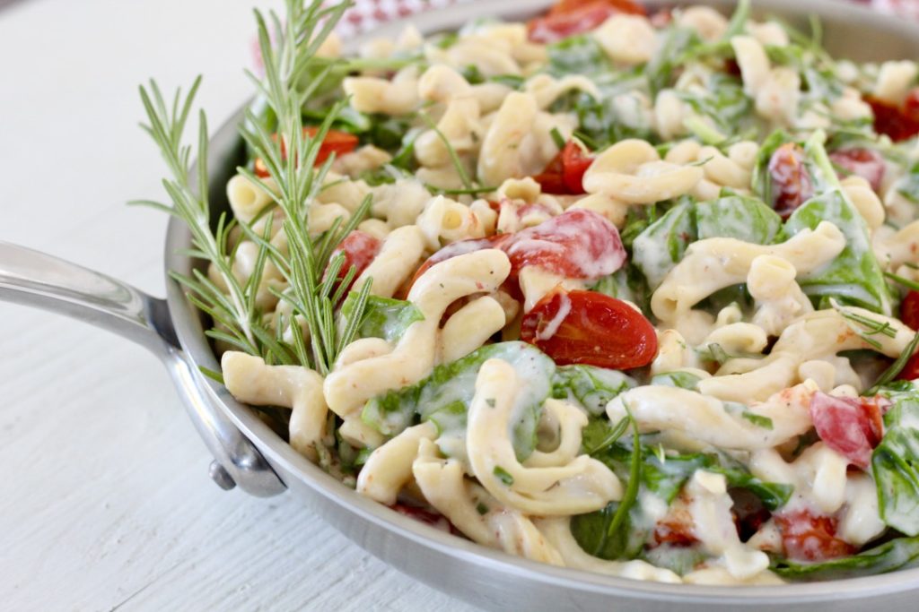 pasta dish in stainless steel skillet