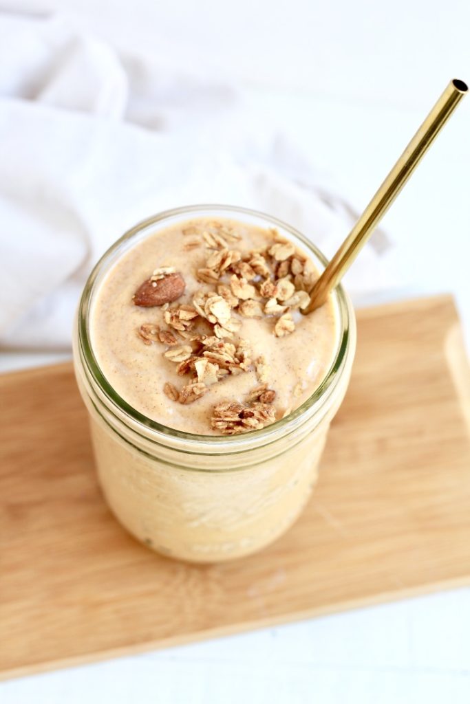 sweet potato smoothie in mason jar with gold metal straw