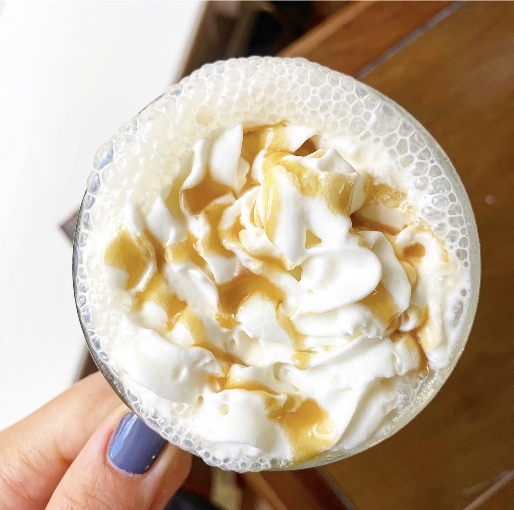 foamy latte with whipped cream