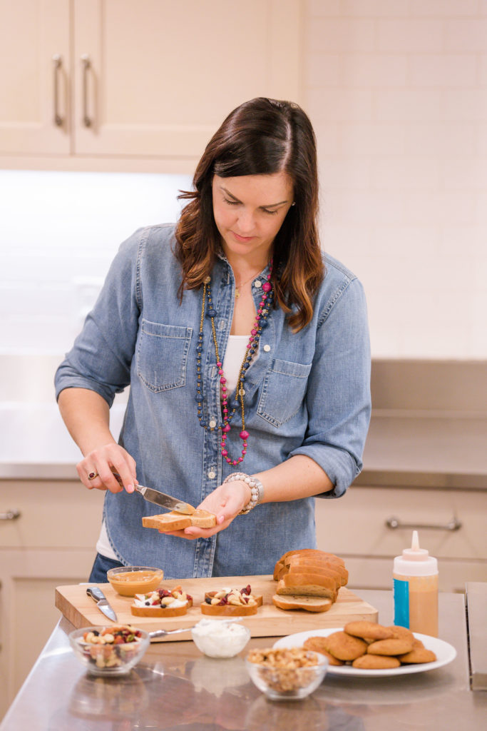 woman with type 1 diabetes making toast in kitchen for blood sugar balance