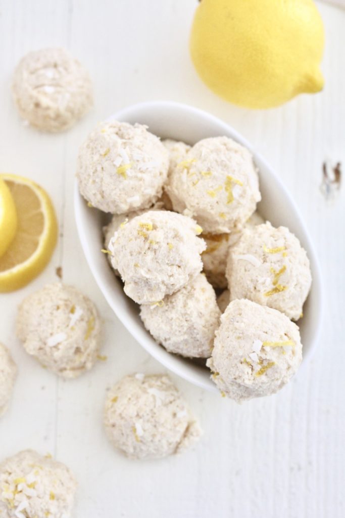 lemon no bake cheesecake bites in white dish with lemon slices