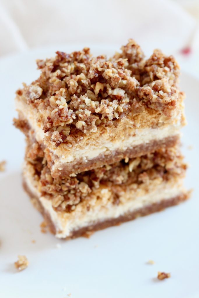 layered pumpkin cheesecake bars with oatmeal streusel