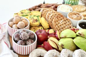 breakfast charcuterie board for christmas with waffles and donuts