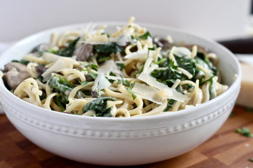 truffle mushroom pasta in white bowl