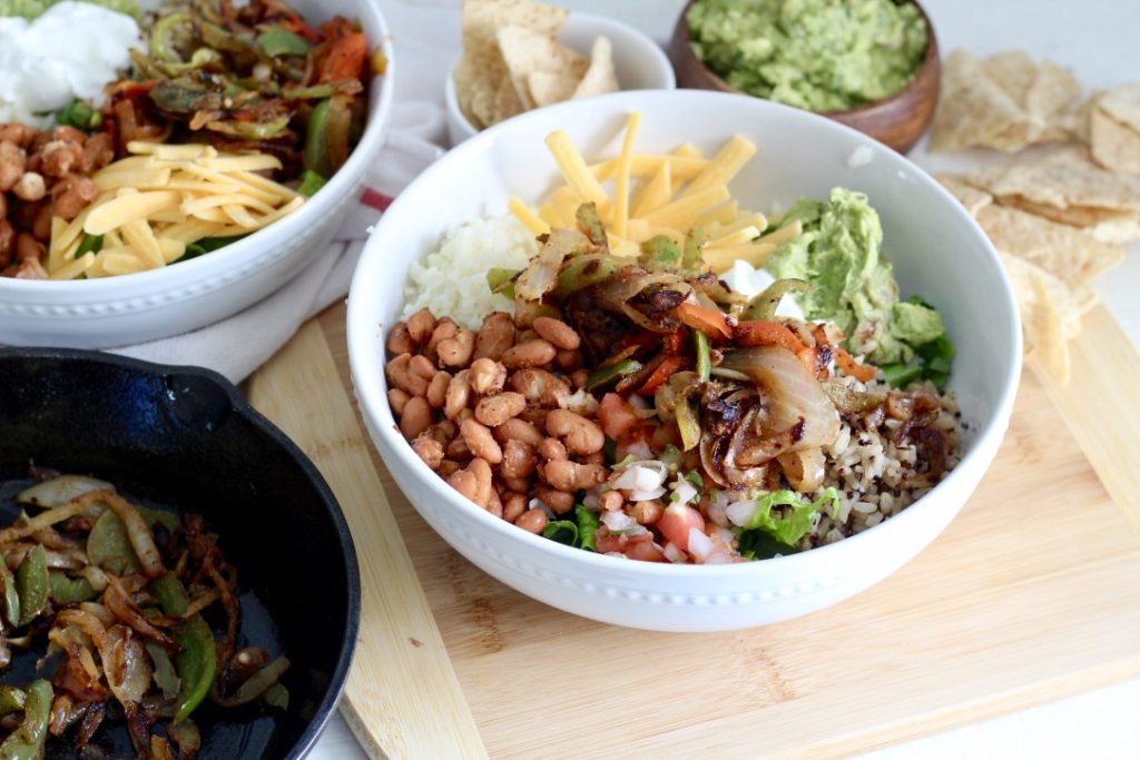 low carb burrito bowl on wood chopping block