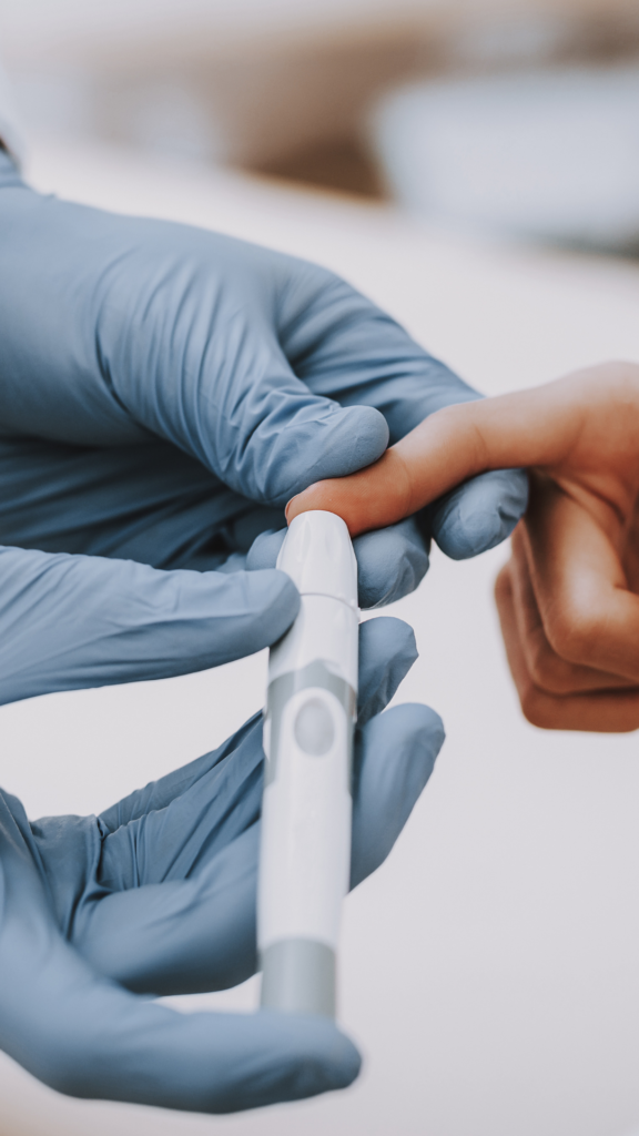 finger being pricked for diabetes blood sugar