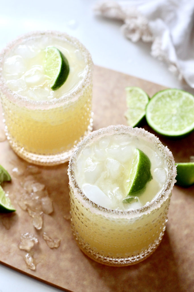 skinny margaritas in glasses with lime wedge