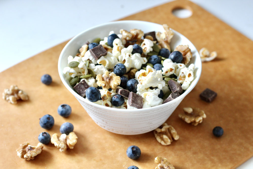 homemade trail mix with blueberries walnuts and popcorn