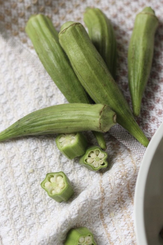 fresh sliced okra on anthropologie white dish towel