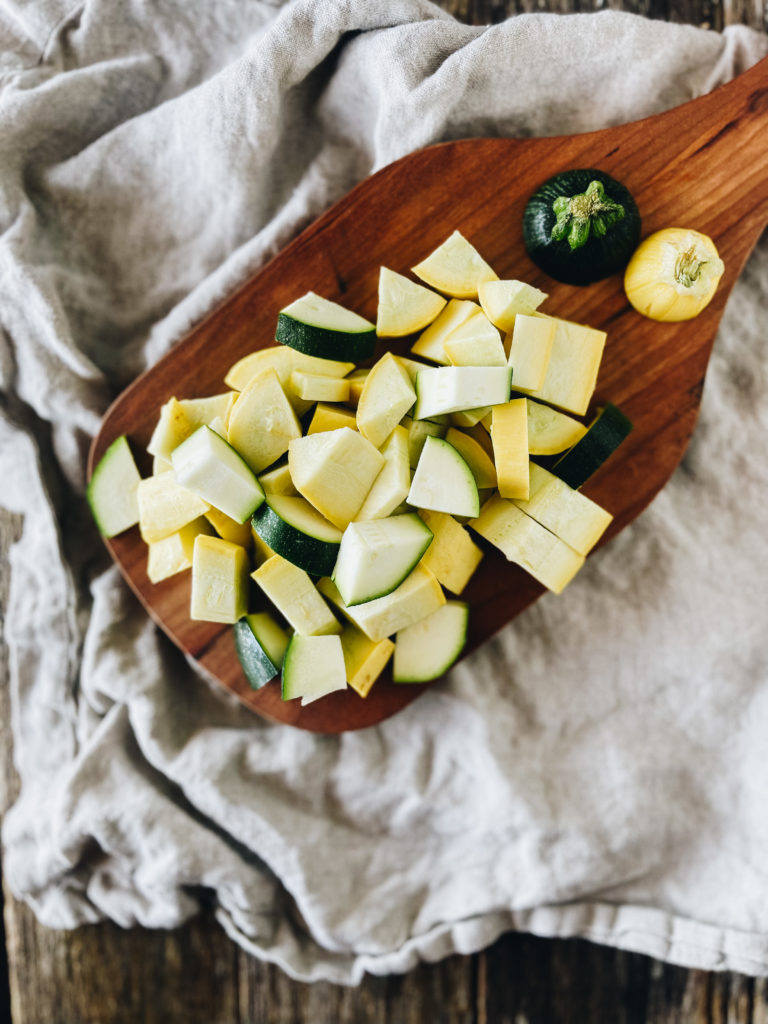 chopped zucchini and squash on wood cutting board