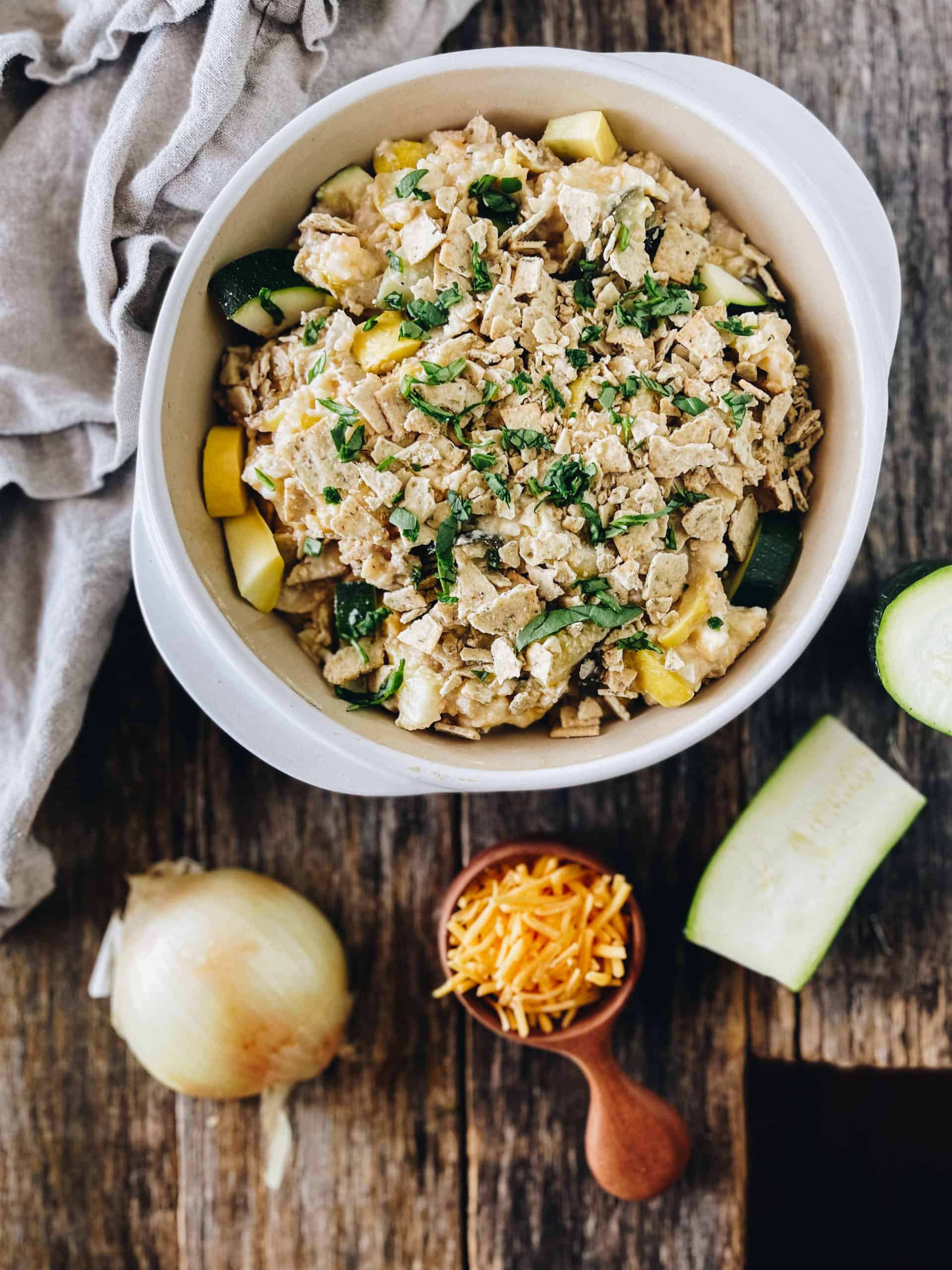 zucchini and squash casserole with shredded cheese and onion