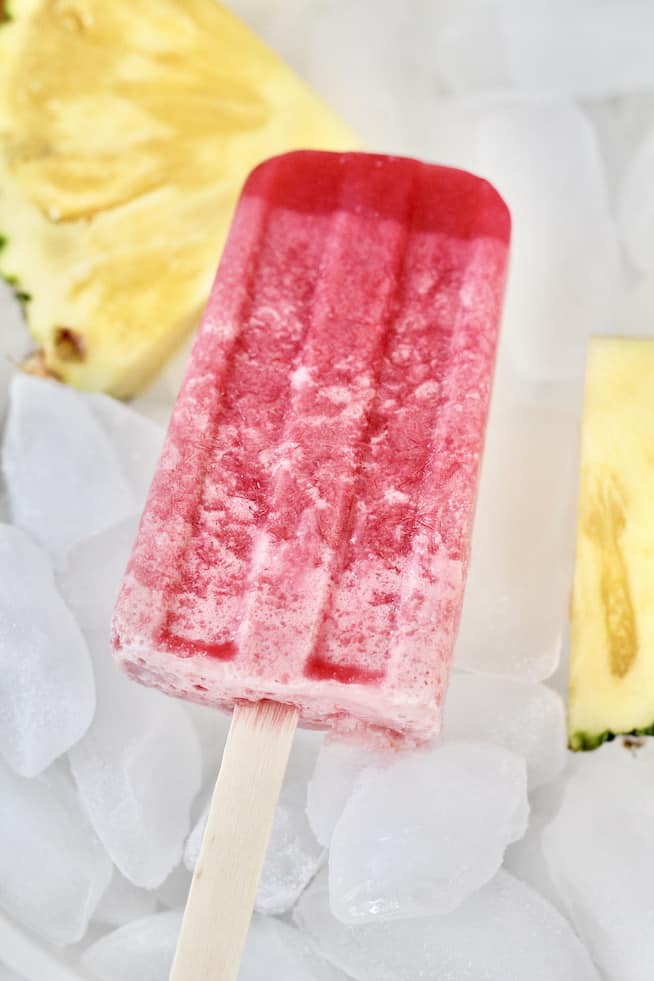 pineapple cherry popsicles on ice