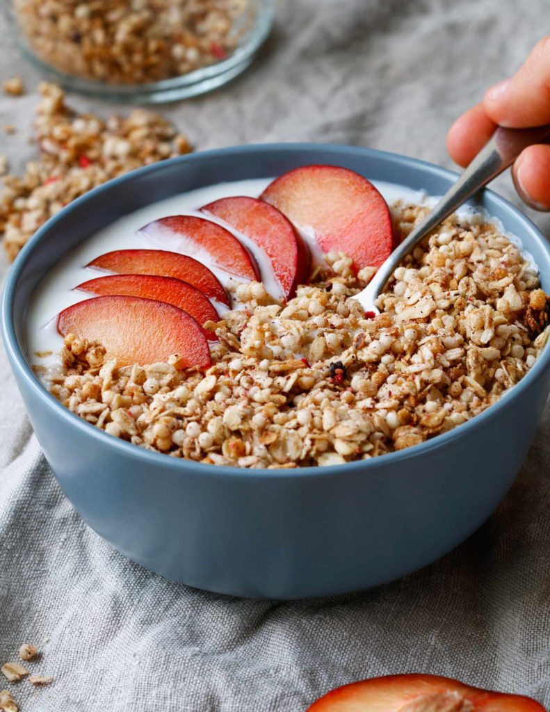 bowl of cereal with nectarines and milk