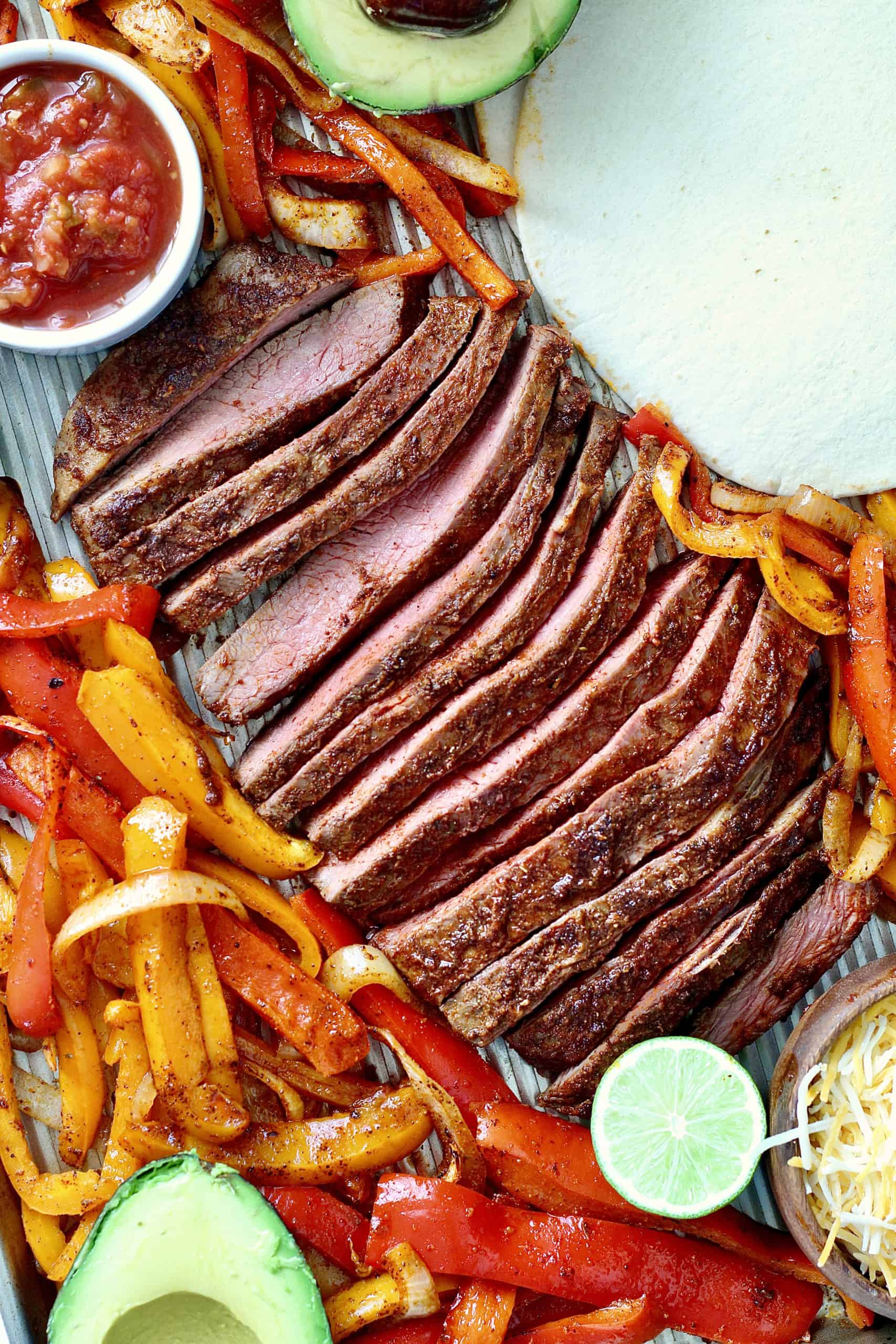 easy sheet pan steak fajitas with bell peppers and onions